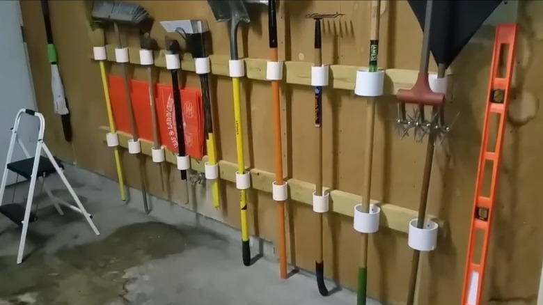 PVC pipes holding gardening tools