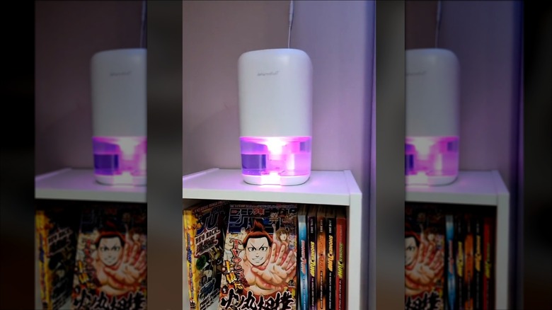 Dehumidifer on a shelf in a home library