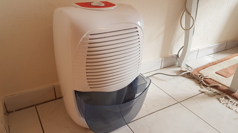 Dehumidifier on the floor in the corner of a storage room