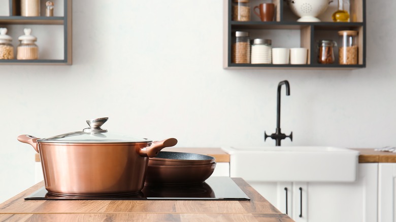 copper pots and pans in kitchen