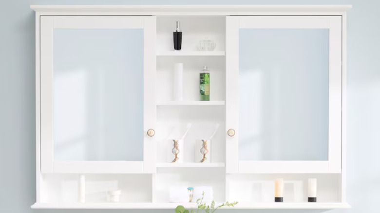 white medicine cabinet doors and shelves