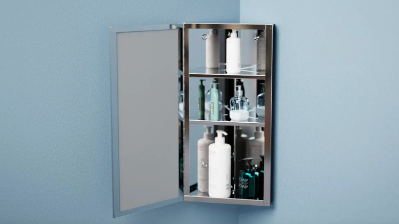 corner medicine cabinet blue wall