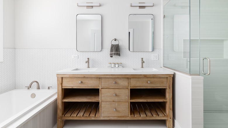 white bathroom with wood vanity