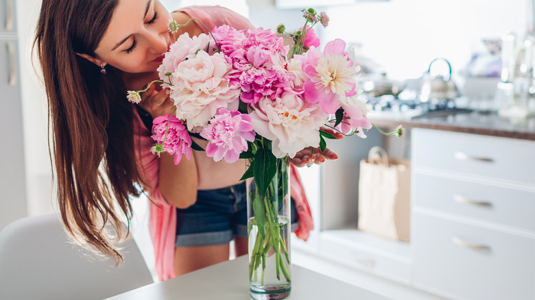 Person smelling flowers