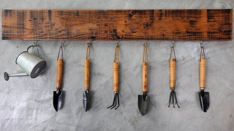 gardening tools on hooks