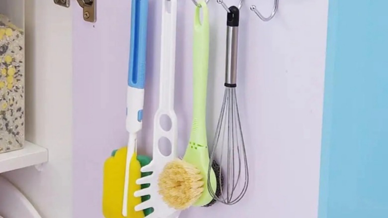 utensils and sponges on hooks