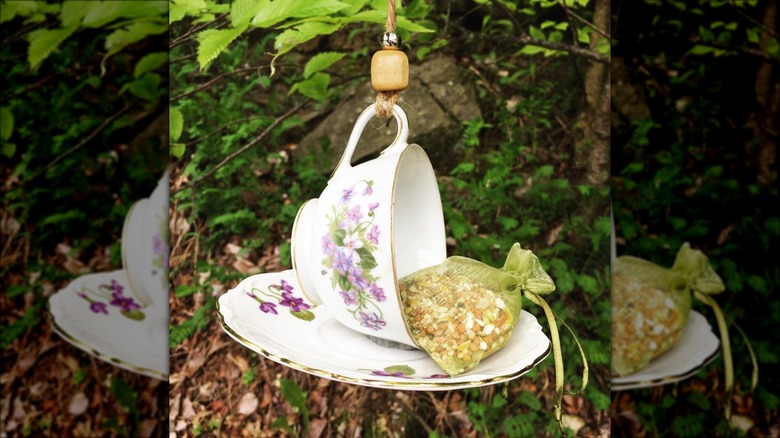 white floral teacup bird feeder