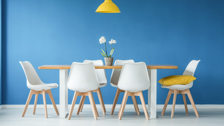 blue room with white chairs