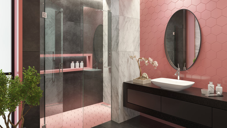 black vanity in pink bathroom