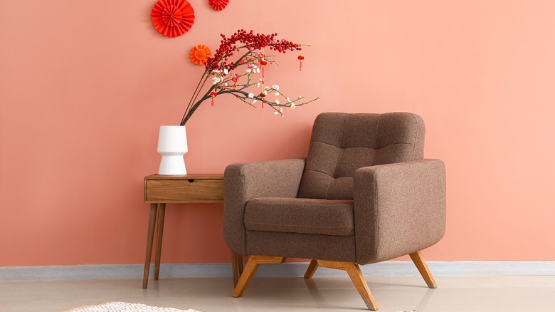 brown armchair in pink room