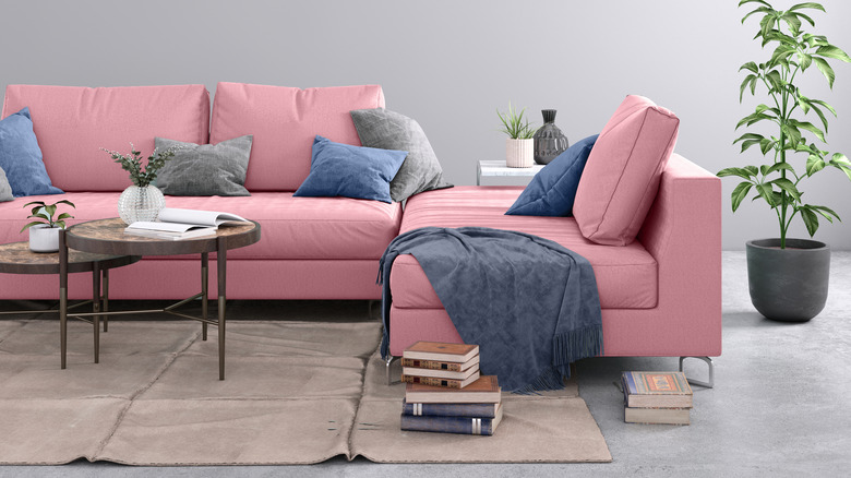 blue pillows on pink couch