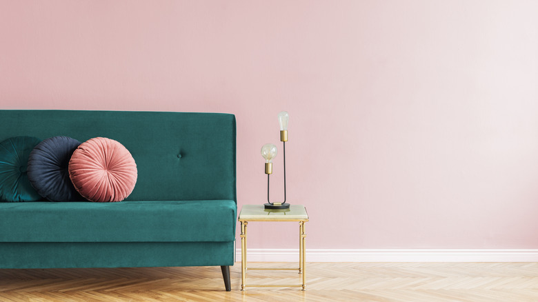 pink room with green couch