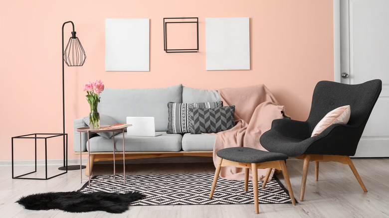 gray couch in pink room