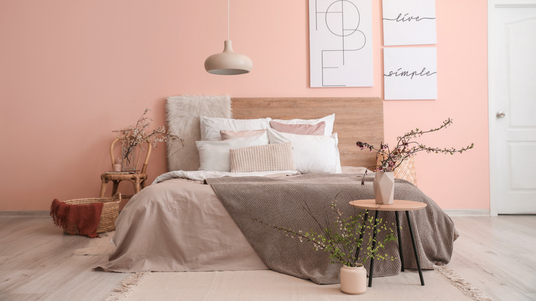 taupe bedding in pink room