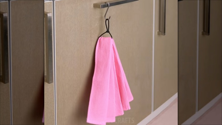 towel hanging by hair tie