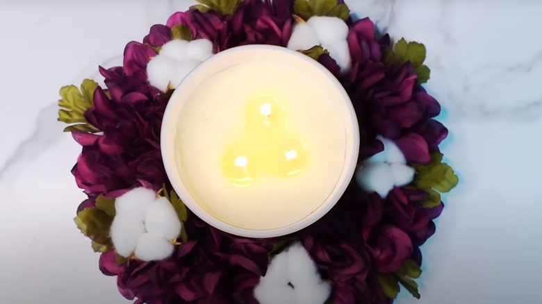 flroal wreath around candle