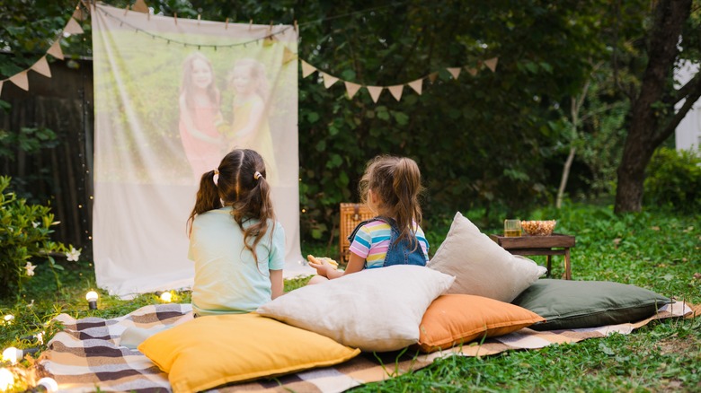 kids watching outdoor movie