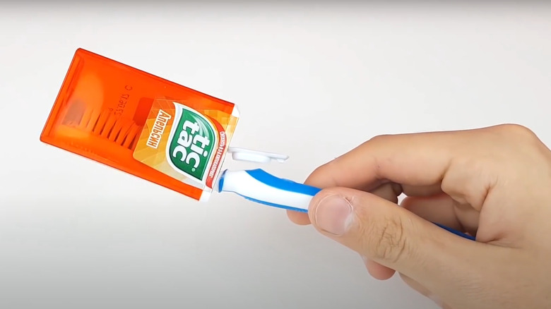 toothbrush in Tic Tac container