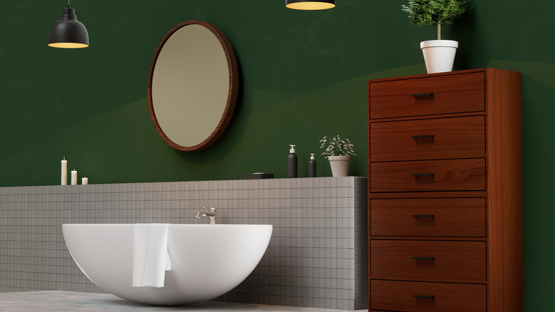 Dark green bathroom wall