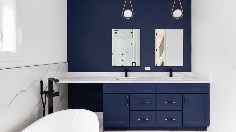 Navy blue accent wall in bathroom