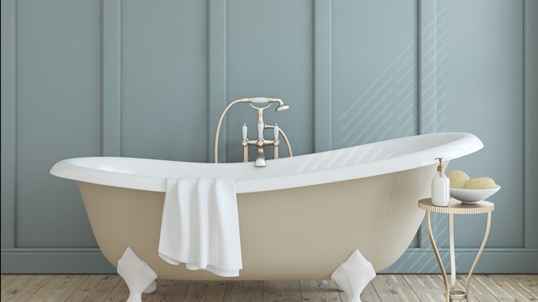 pale blue bathroom paneling behind tub