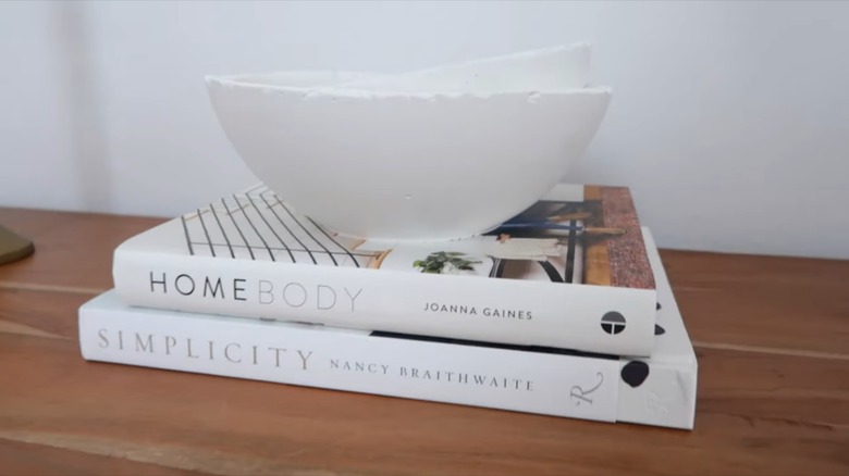 decorative bowl on stacked books