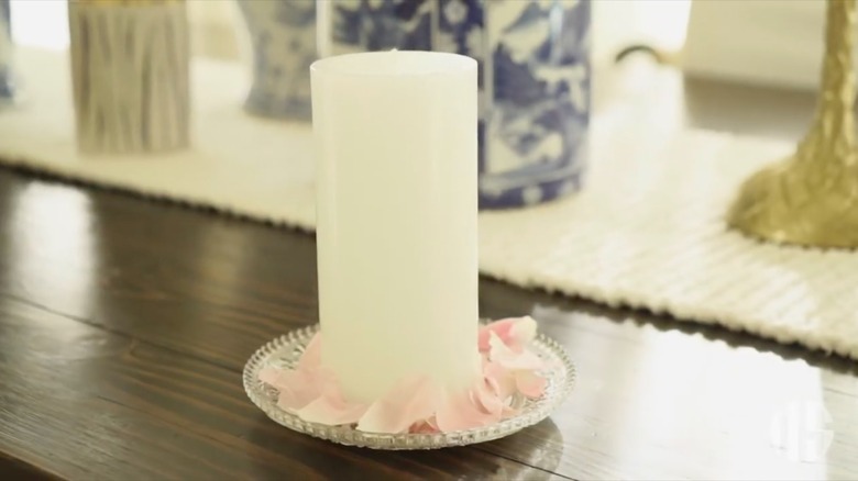 candle on china plate
