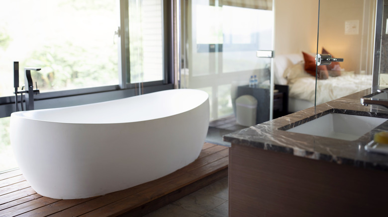 red wood platform beneath bathtub