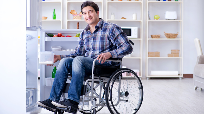 Person in front of refrigerator