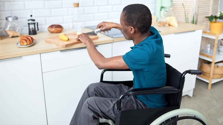 Person using cutting board