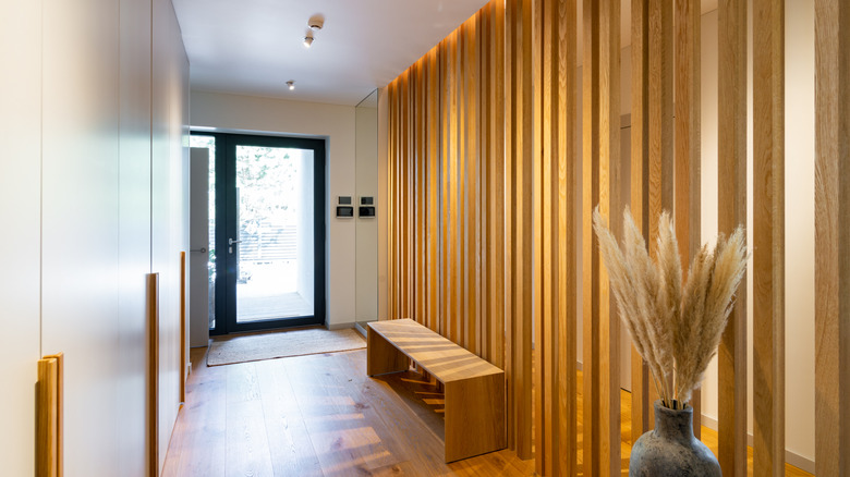 Wooden panels on wall in entryway of home