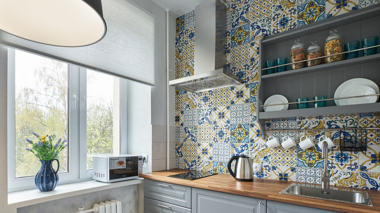 Colorful tiles along kitchen wall