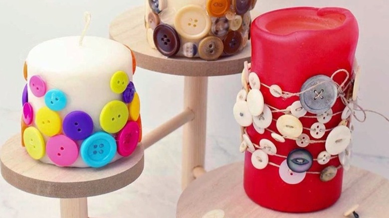 pillar candles covered in buttons