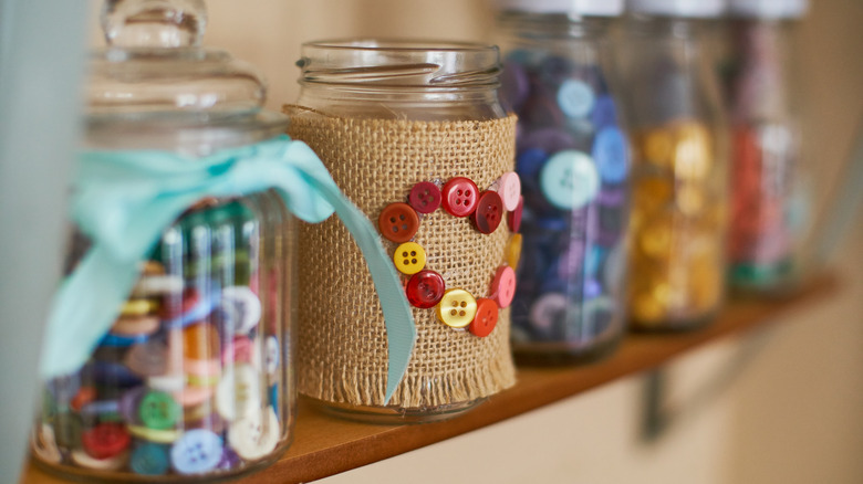 jars with buttons on shelf