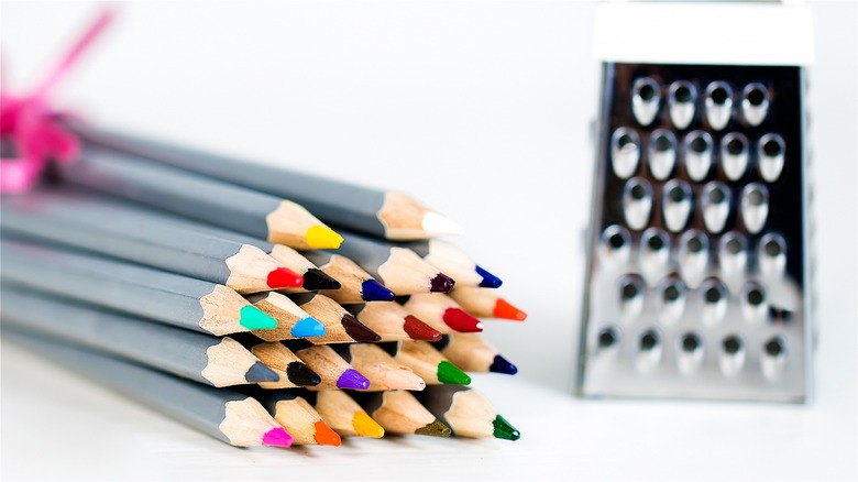 box cheese grater and pencils