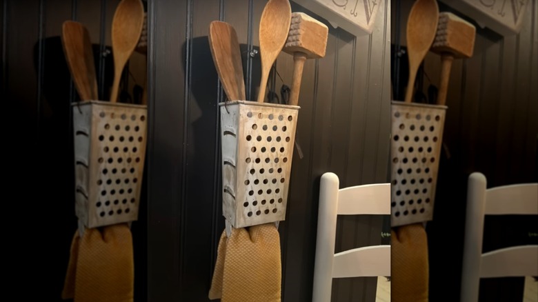 grater with wooden utensils inside