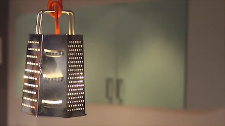 hanging cheese grater pendant lamp