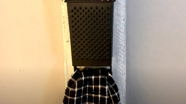 black cheese grater towel holder