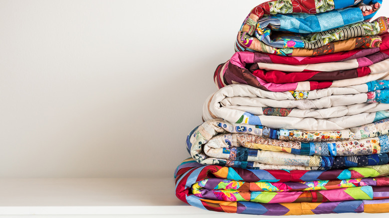 Stack of patchwork quilts