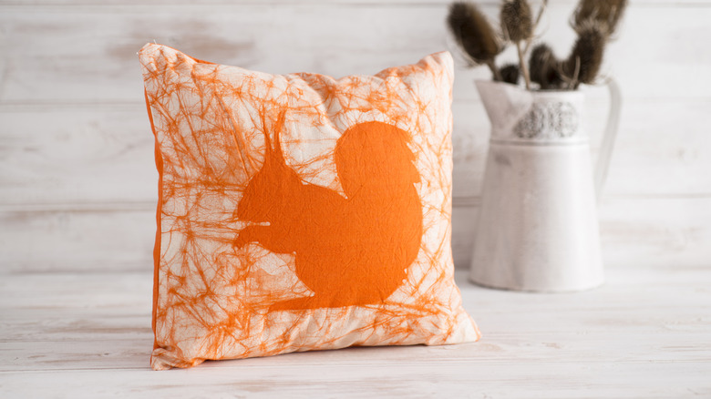 orange and white squirrel pillow