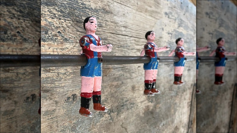 foosball figurine bar on wall