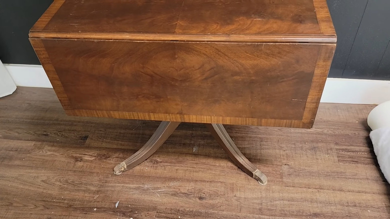 Scratched drop leaf dining table