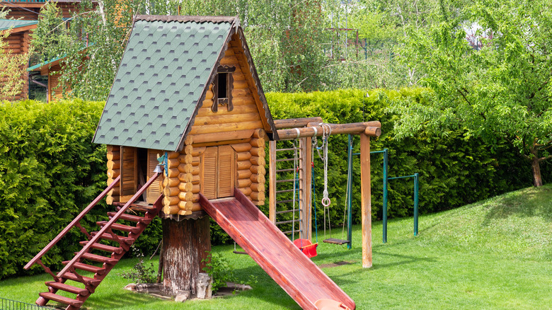 cabin playhouse with slide 