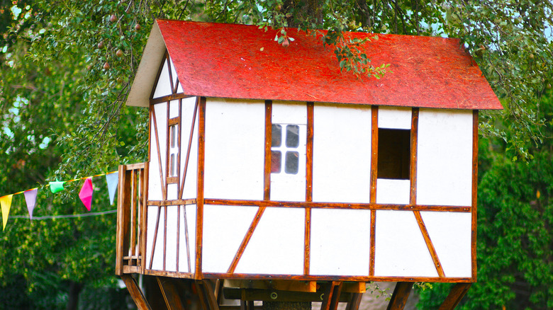 white and red german treehouse