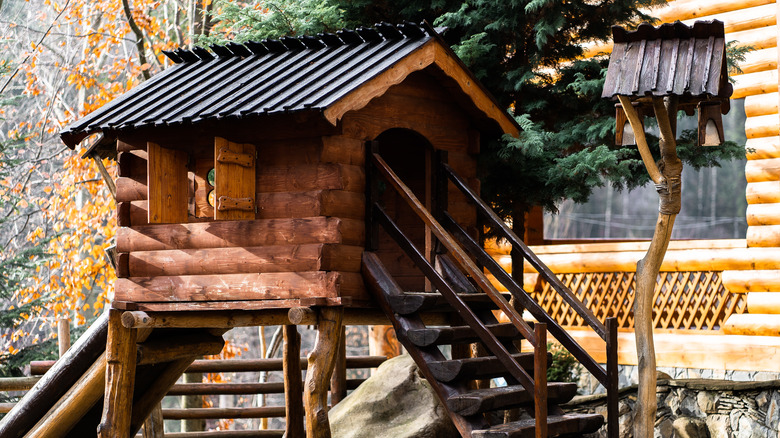 log cabin treehouse with stairs