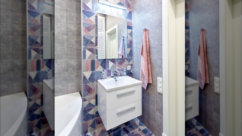 pink and purple tiles in bathroom