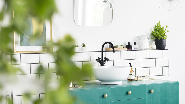 teal vanity in bathroom