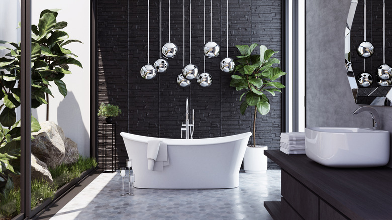 silver globes suspended above bathtub