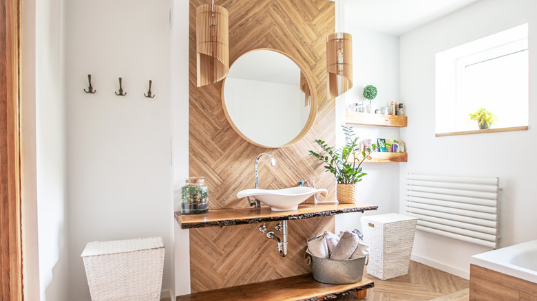 wooden pendants above bathroom vanity