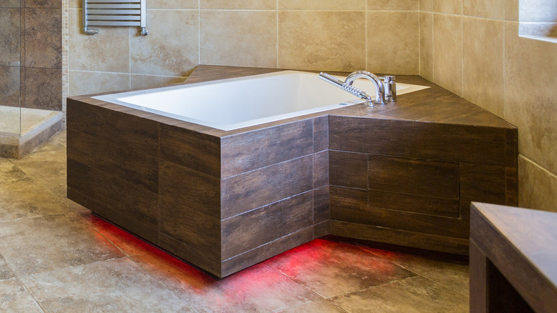 wooden bathtub with red lights